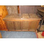 AN OAK FOUR PANEL COFFER W-112 CM