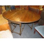 A LARGE OAK BARLEYTWIST GATELEG DINING TABLE H-79 CM W-162 CM (NO CHAIRS)