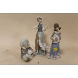 THREE LLADRO FIGURES COMPRISING OF A FIGURE OF AN ESKIMO PLAYING WITH A POLAR BEAR CUB, GIRL HOLDING