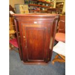 A 19TH CENTURY OAK HANGING CORNER CUPBOARD