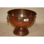 A HAMMERED FINISH COPPER FOOTED TWIN HANDLED BOWL WITH INSET GEORGIAN COINS TO OUTER RIM HEIGHT -