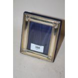 A HALLMARKED SILVER EASEL BACK PHOTO FRAME - REBATE SIZE 9.5CM X 7CM