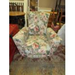 A VINTAGE FLORAL ARMCHAIR