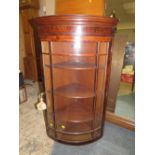 A 19TH CENTURY GLAZED BOW FRONTED HANGING CORNER CABINET