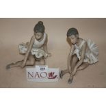 TWO NAO SEATED BALLERINA FIGURES, TOGETHER WITH A NAO CERAMIC ADVERTISING SIGN (3)