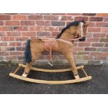 A VINTAGE CHILDS ROCKING HORSE