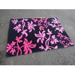 A MODERN B & Q WOOLLEN RUG 120 X 170 CM