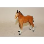 A BESWICK CHESTNUT FOAL