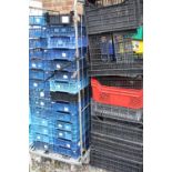 A QUANTITY OF PLASTIC STACKING TRAYS ( CAGE NOT INCLUDED )