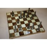 A MARBLE EFFECT CHESS SET WITH METAL CHESS MEN