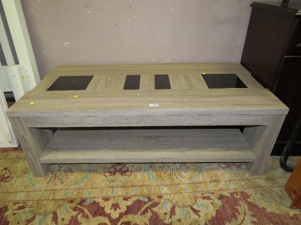 A MODERN LIMED COFFEE TABLE WITH GLASS INSERTS h-41 w-120 CM