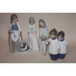 FOUR ASSORTED NAO FIGURES TO INCLUDE A FIGURE OF A GIRL HOLDING FLOWERS WITH A PUPPY