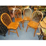 A SET OF FOUR HOOP BACK CHAIRS