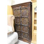 AN UNUSUAL COLONIAL STYLE TWO DOOR CUPBOARD WITH METALLIC EMBOSSED PANELS H-181 W-95 CM