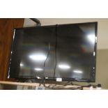 A JVC 32" FLATSCREEN TV WITH LIGHT SCRATCHES TO THE SCREEN, WITH REMOTE