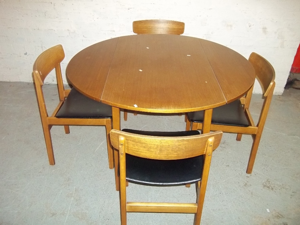 A TEAK CIRCULAR DROP LEAF DINING TABLE AND FOUR CHAIRS - Image 2 of 3