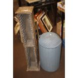 A MODERN CD RACK AND A WICKER BASKET