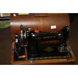 A CASED SINGER SEWING MACHINE