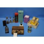 A COLLECTION OF PERFUME BOTTLES, SOME WITH CONTENTS, BUTTONS ETC.
