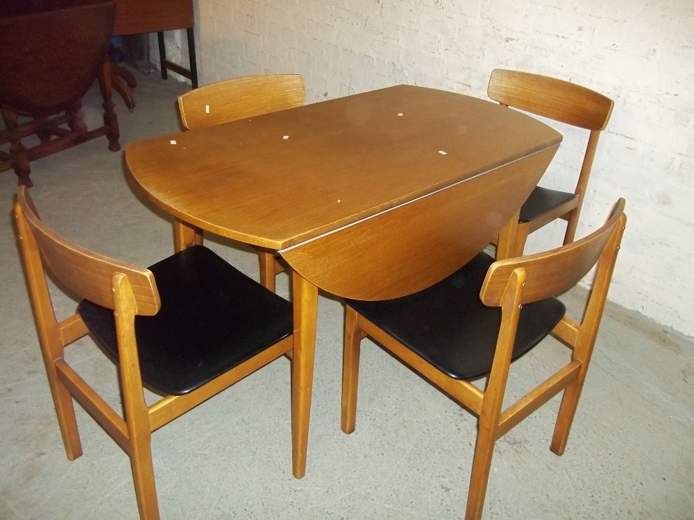 A TEAK CIRCULAR DROP LEAF DINING TABLE AND FOUR CHAIRS - Image 3 of 3