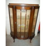 A BOWED CHINA CABINET