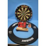 A WINMAU DARTBOARD WITH COVER, DARTS AND FLIGHTS