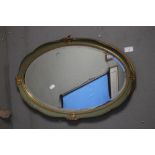 A BEVEL EDGED GILT FRAMED OVAL MIRROR 62 X 40 CM