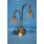 A BRASS LAMP WITH VASELINE GLASS SHADES