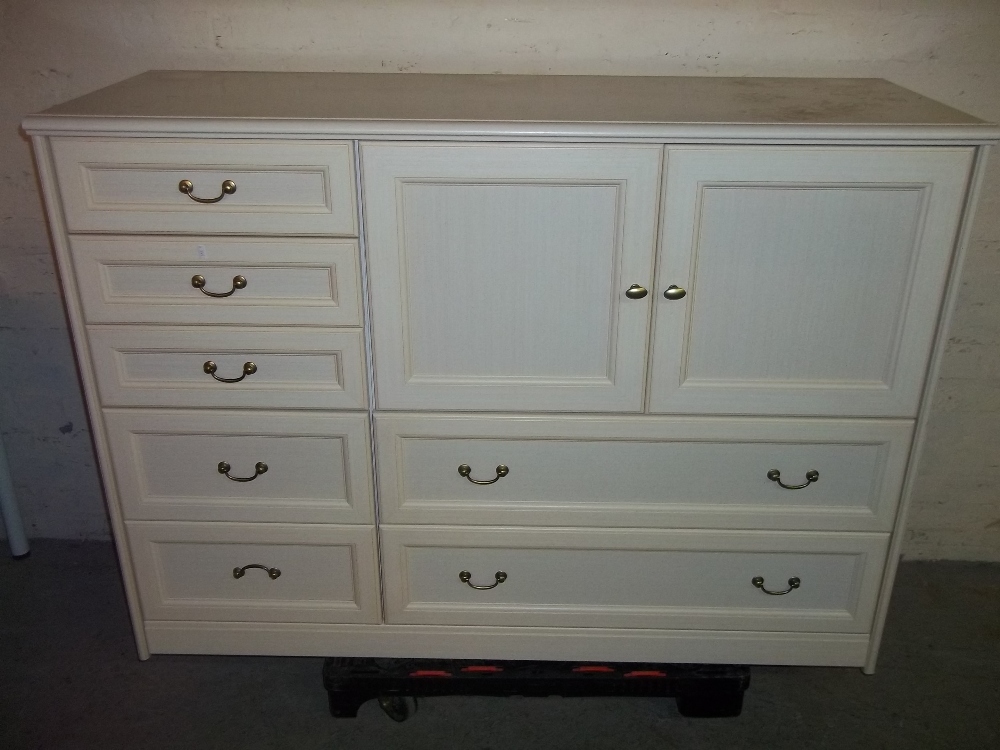 A MODERN SIDEBOARD WITH SEVEN DRAWERS