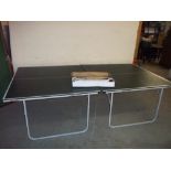 A TABLE TENNIS TABLE WITH ACCESSORIES