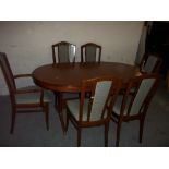 A STAG EXTENDING DINING TABLE WITH SIX CHAIRS