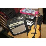 AN EPIPHONE AMPLIFIER, AN ELECTRIC KEYBOARD (NO PLUG) AND A SMALL ACOUSTIC GUITAR