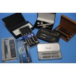 A BOX OF PEN SETS INCLUDING HARRODS, ARTAMIS, ESQUIRE, PARKER, JASPER CONRAN ETC.