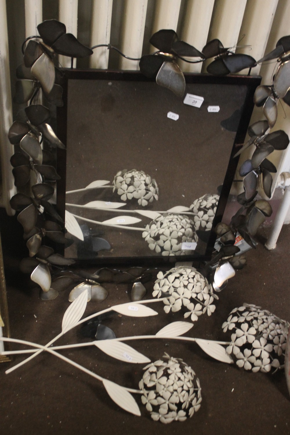 A METAL FRAMED MIRROR A/F AND A METAL WALL ART OF FLOWERS