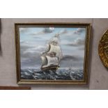 FRAMED AND GLAZED OIL PAINTING OF A GALLEON AT SEA - 60CM X 50CM