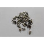 A BAG OF LOOSE SILVER CHARMS APPROX WEIGHT 69G