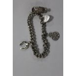 A VINTAGE HALLMARKED SILVER CHARM BRACELET APPROX WEIGHT - 35.5G