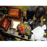 A SMALL TRAY OF COLLECTABLES TO INCLUDE AN EBONISED WOODEN ELEPHANT FIGURE AND FRAMED AND GLAZED CAP