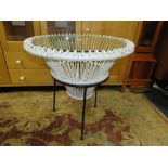 A RETRO PAINTED WICKER GLASS TOPPED TABLE WITH SEPARATE METAL STAND H-64 CM DIA. 63 CM