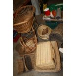 A SELECTION OF WICKERWARE TO INCLUDE A COT AND BASKETS