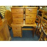 A HONEY PINE DESK AND A PAIR OF BEDSIDE CHESTS (3)