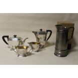 AN ART DECO STYLE SILVER PLATED FOUR PIECE TEA SERVICE TOGETHER WITH A BOXED CLAUDIO DESIGN METAL JU