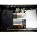 TWO PLAYSTATION 2 CONSOLES WITH CONTROLLERS AND GAMES