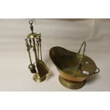 A BRASS COAL BUCKET AND COMPANION SET