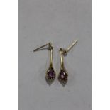 A PAIR OF 9 CARAT GOLD EARRINGS SET WITH PINK AND CLEAR STONES APPROX WEIGHT - 2.1G