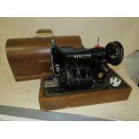 A CASED SINGER SEWING MACHINE