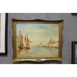 GILT FRAMED OIL ON BOARD CONTINENTAL RIVER SCENE WITH MOORED BOATS SIGNED JEAN CALEY LOWER RIGHT -