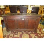 AN ANTIQUE OAK TRIPLE PANEL COFFER H-73 CM W-131 CM - SOME DAMAGE