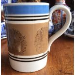 GEORGIAN MOCHA WARE TANKARD WITH BLUE RIM AND TREE DESIGN, PRINTED MARK TO FRONT, DATING TO PRE