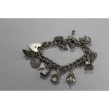 A LARGE VINTAGE HALLMARKED SILVER CHARM BRACELET APPROX WEIGHT 78.9G